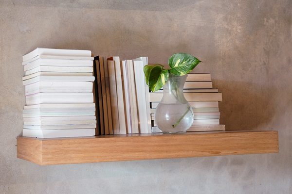 Stack,Of,Books,On,Floating,Wooden,Bookshelf.,Education,And,Knowledge