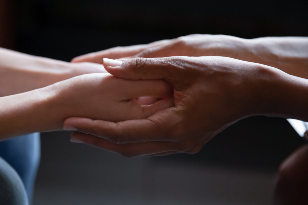 Close,Up,Young,African,American,Woman,Holding,Hand,Of,Female
