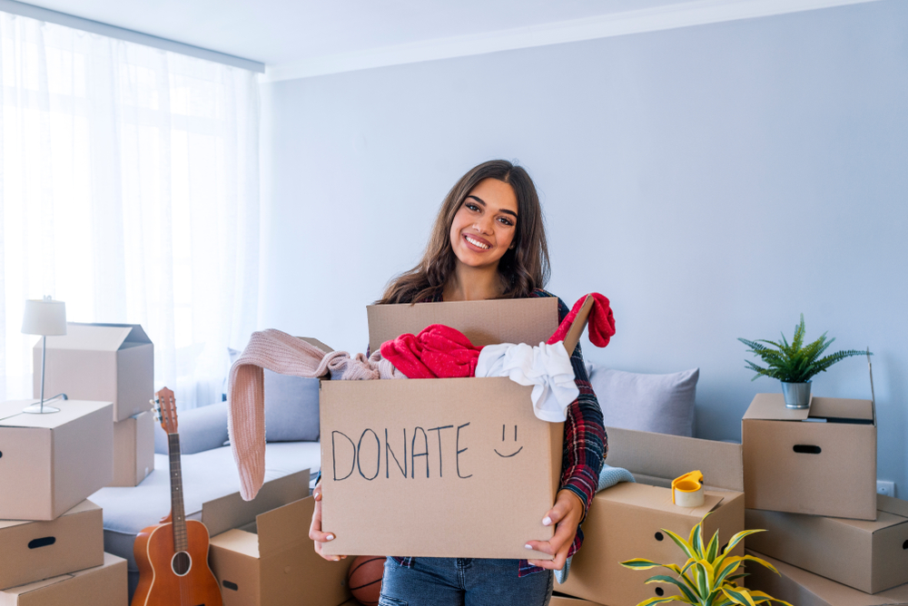 Donation,Concept.,Woman,Holding,A,Donate,Box,With,Full,Of