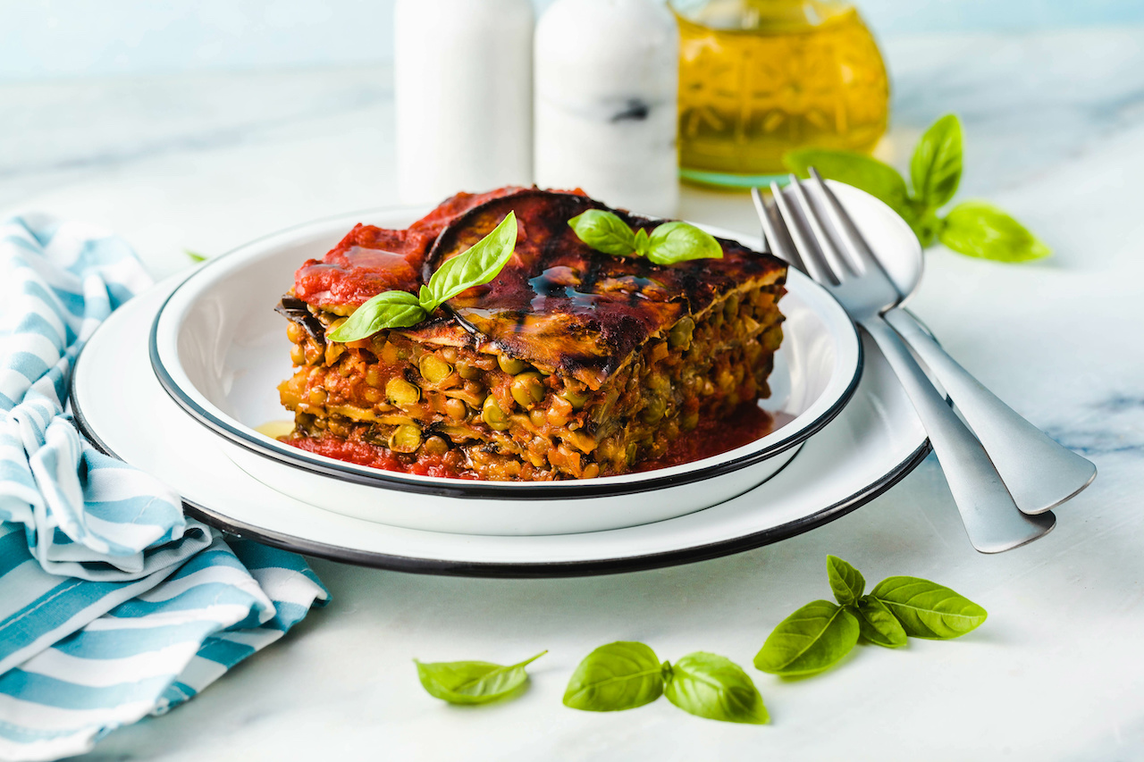 gluten free vegan lasagna. from grilled eggplant, green peas, lentils and vegetables. delicious healthy comfort food for the whole family for the holidays. italian parmigiana
