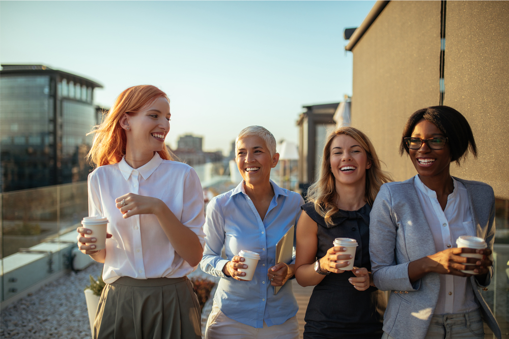 Happy,Businesswoman,Having,A,Coffee,Break,Together.