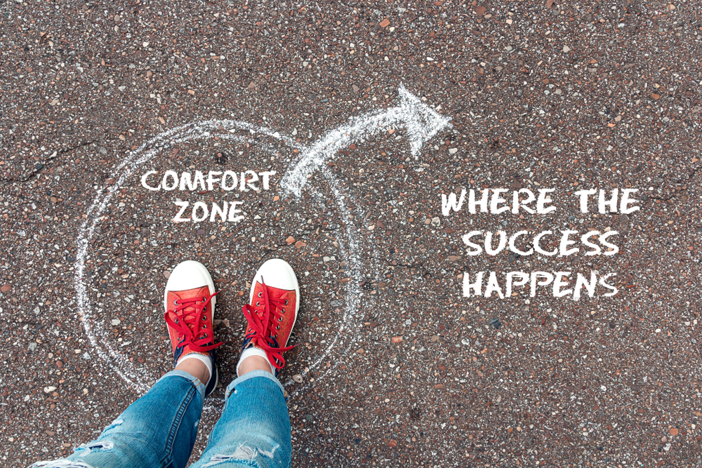 Exit,From,The,Comfort,Zone,Concept.,Feet,In,Red,Sneakers