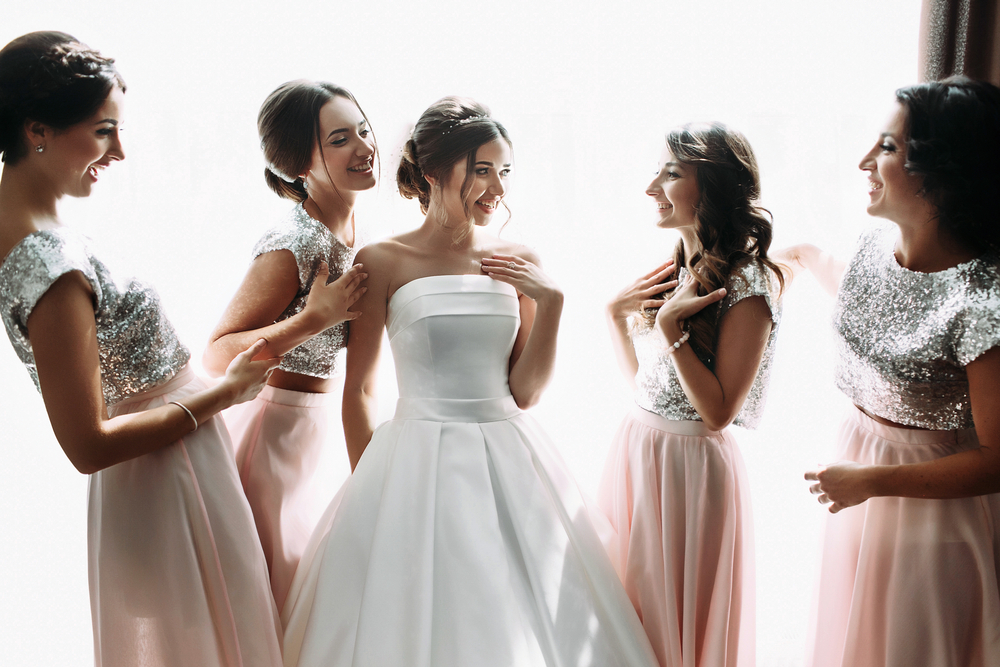 Beautiful,Bride,&amp;,Bridesmaids,Posing,Near,Window,,Wedding,Preparation