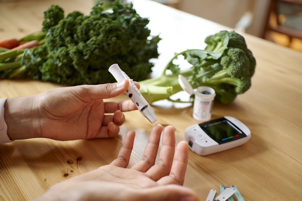 Senior,Woman,Hands,Using,Lancet,On,Finger,At,Home,To
