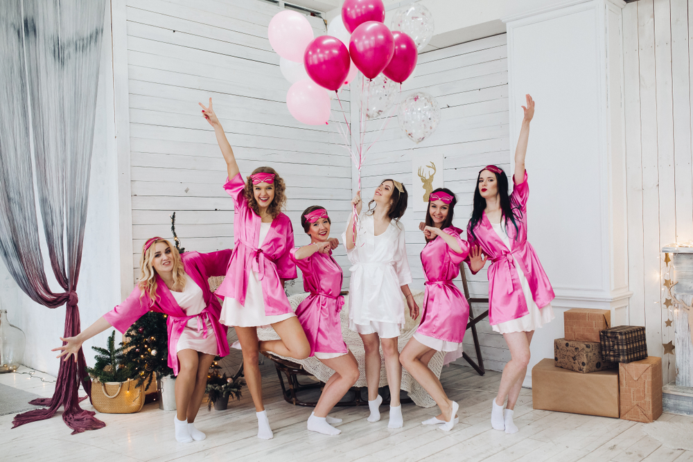 Full,Length,Portrait,Of,Happy,Lovely,Girlfriends,In,Pink,Robes