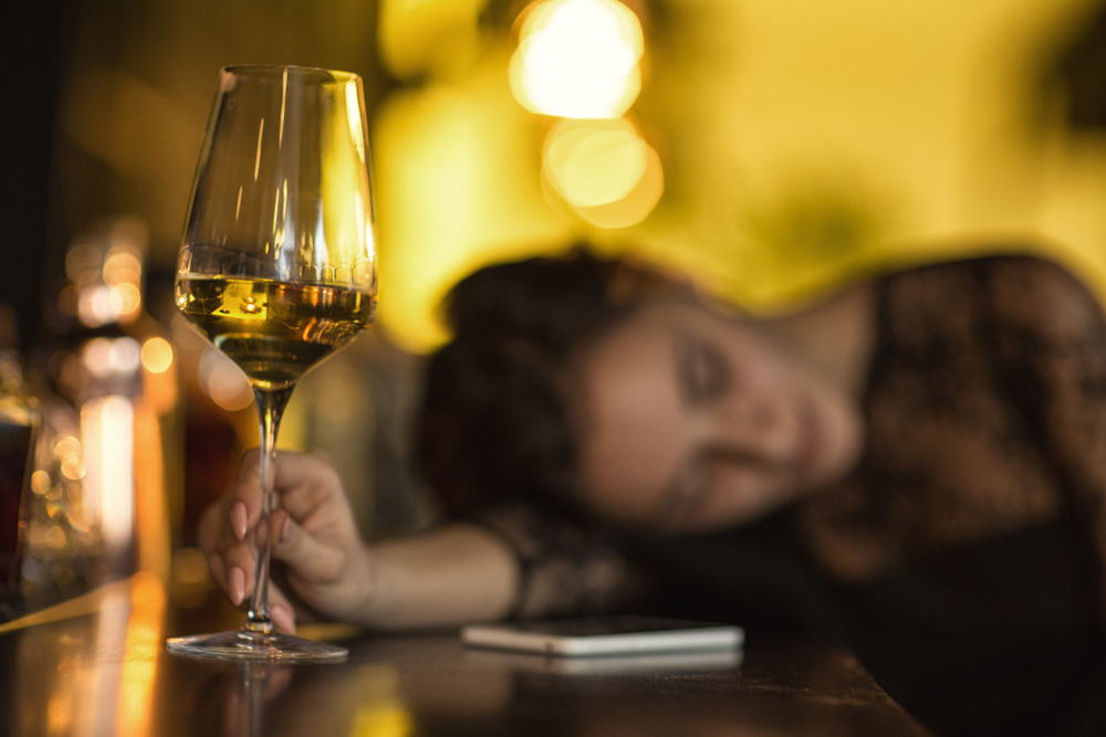 Selective,Focus,On,A,Glass,Of,Wine,On,The,Bar