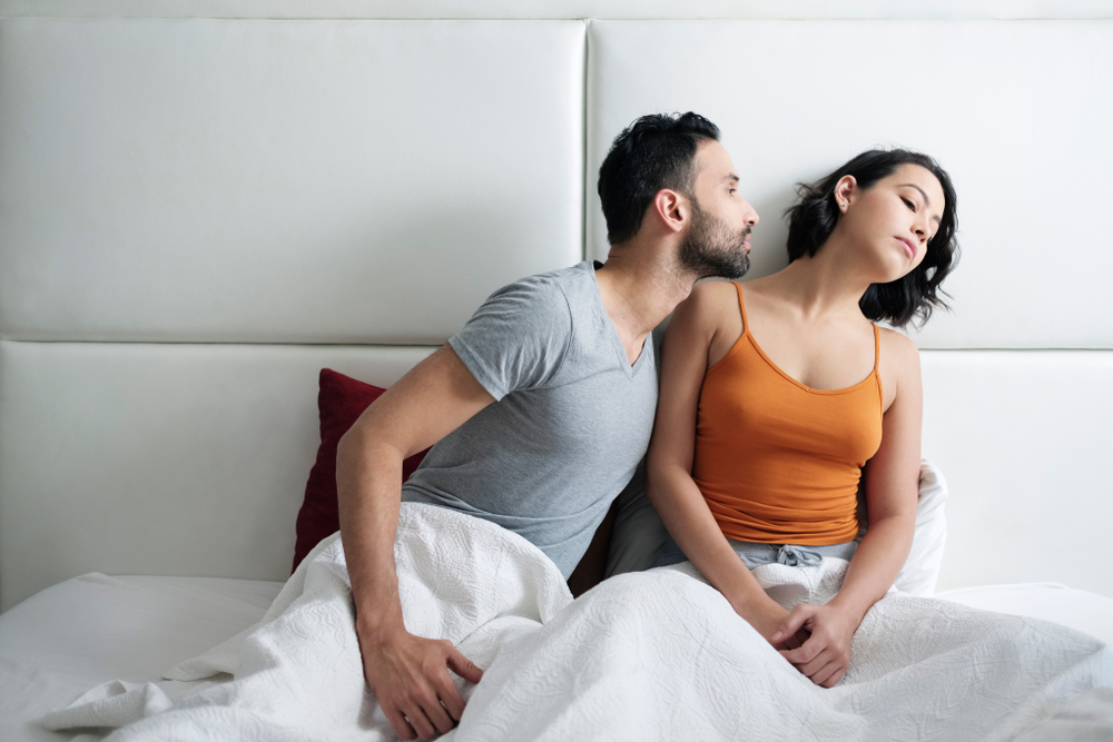 Angry,Woman,Refusing,Reconciliation,With,Man,After,Fight,In,Bed.
