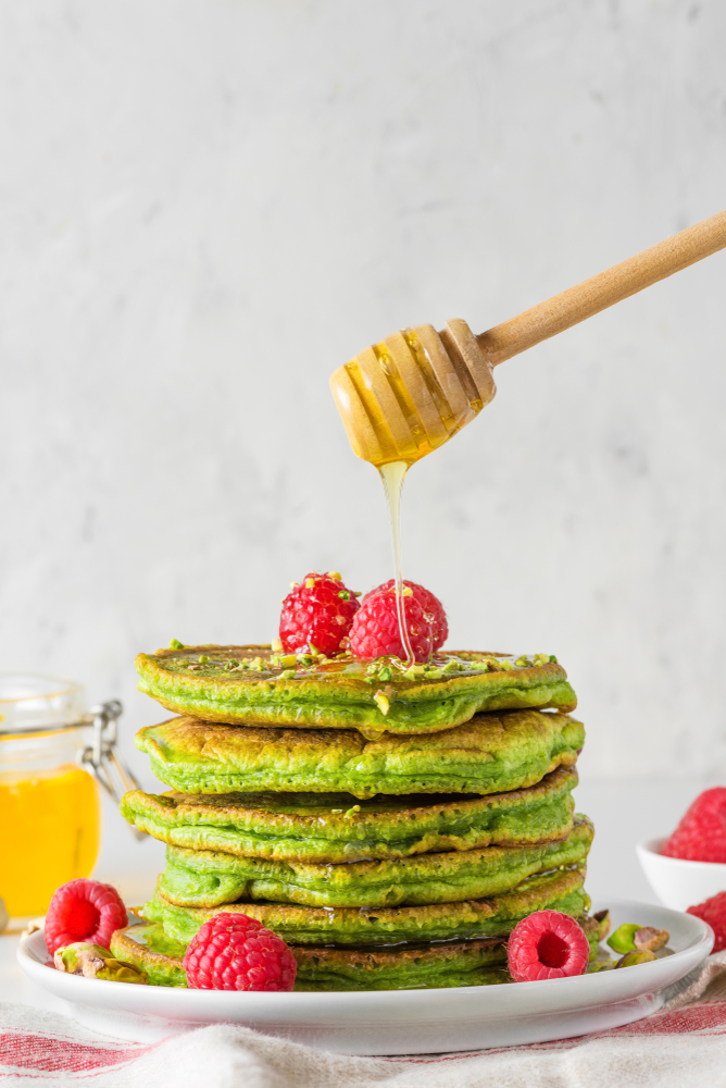 Stack,Of,Homemade,Pancakes,With,Matcha,Tea,,Fresh,Raspberries,And
