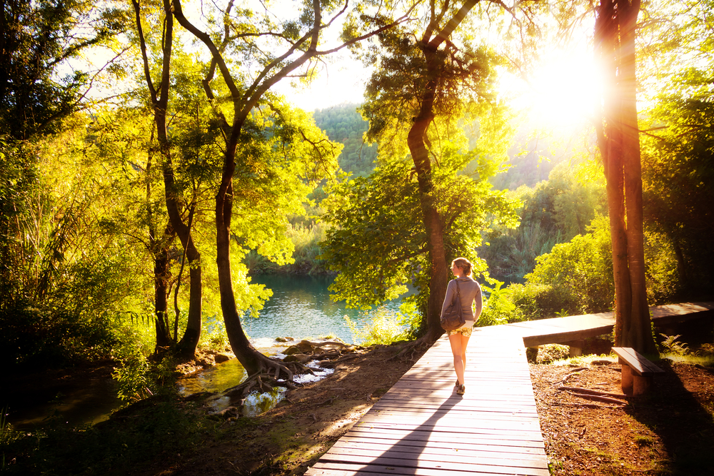 Beautiful,Young,Woman,Walks,In,Krka,National,Park,In,Croatia
