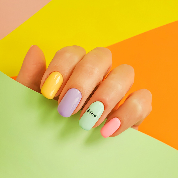 Female,Hand,Beautiful,Manicure,On,A,Colored,Background