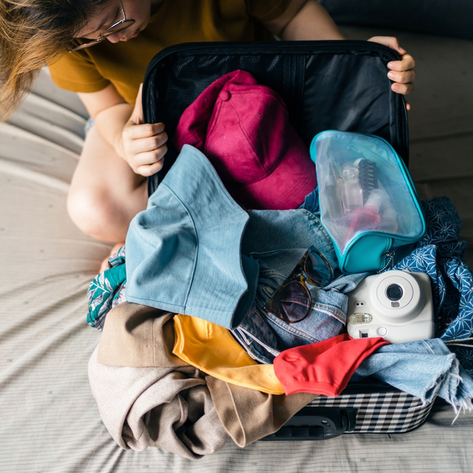Asian,Woman,Looking,At,Her,Messy,Belongings,Such,As,Sunglasses,