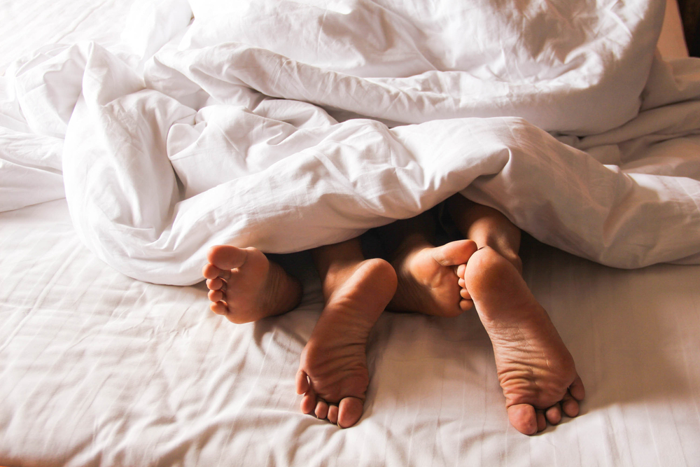 Passionate,Love.,Feet,Of,A,Young,Couple,That,Lying,On