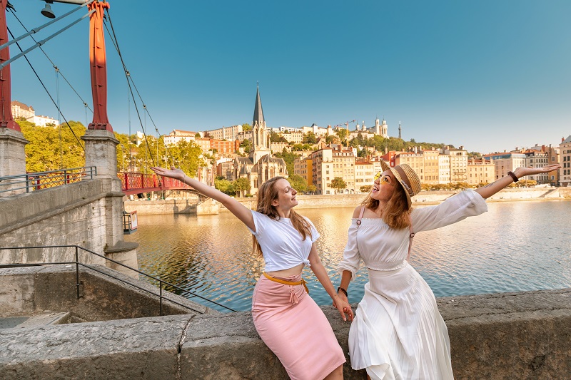 Two,Happy,Girls,Friends,Walking,On,Saint,Georges,Pedestrian,Bridge