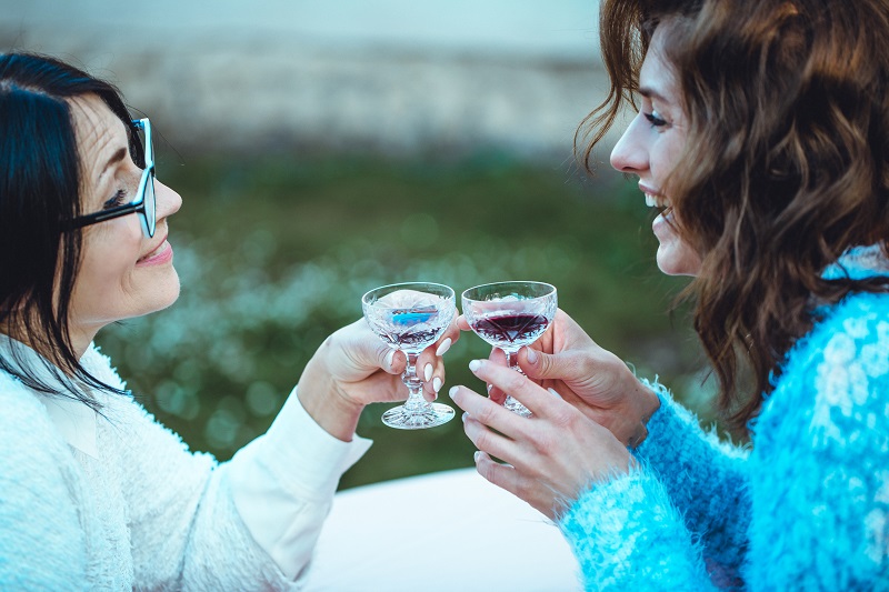 Friends,Drinking,Wine,In,Restaurant.,Beautiful,Young,Woman,Drinking,Wine