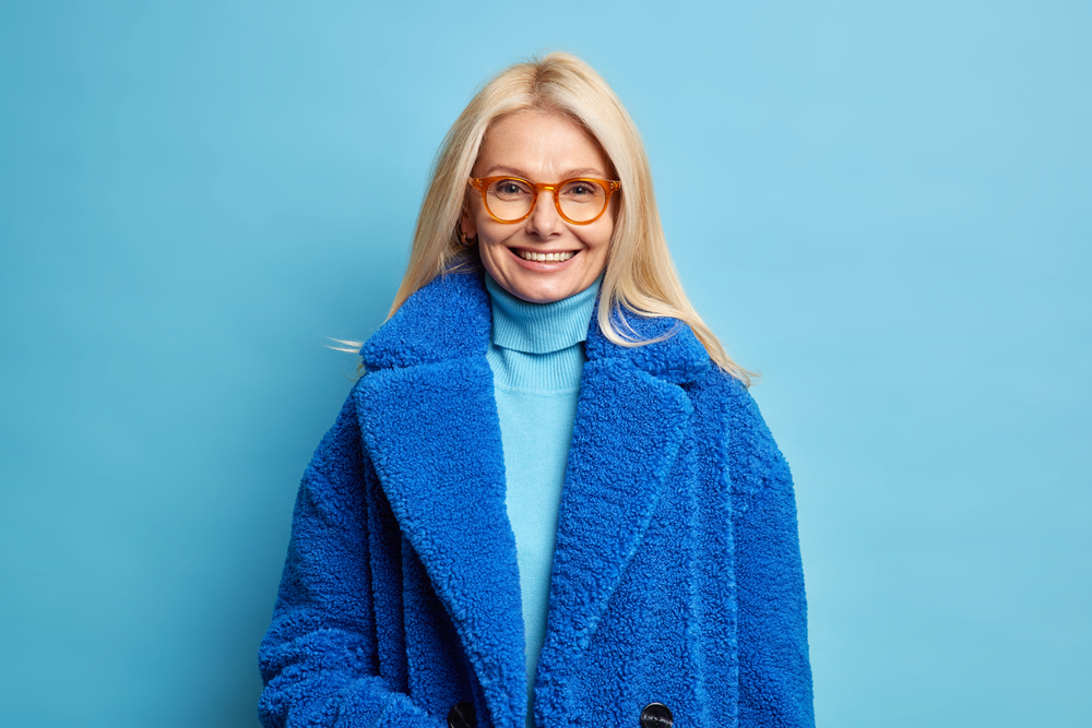 Smiling,European,Woman,With,Blonde,Hair,Dressed,In,Blue,Winter