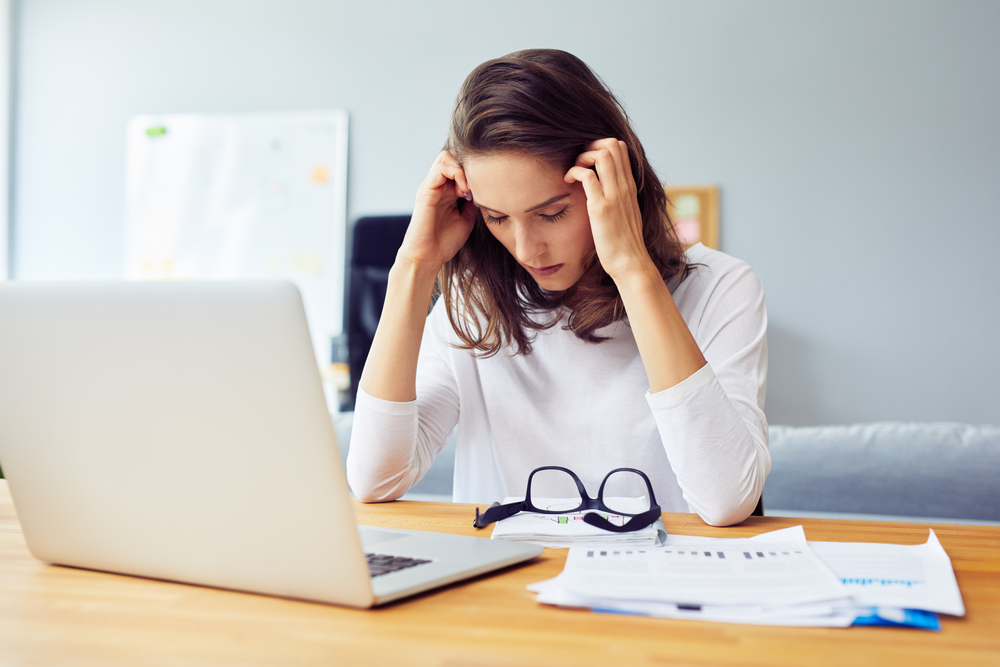 Stressed,Young,Woman,Sitting,At,Desk,Working,From,Home,Office