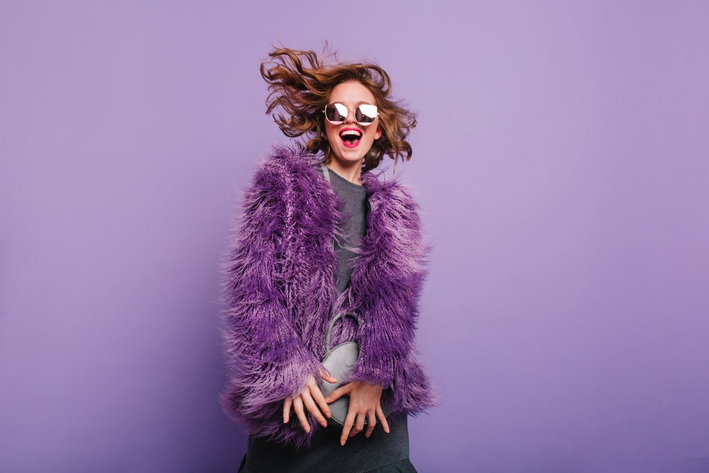 Gorgeous,Short-haired,Girl,In,Sunglasses,Dancing,On,Purple,Background,With