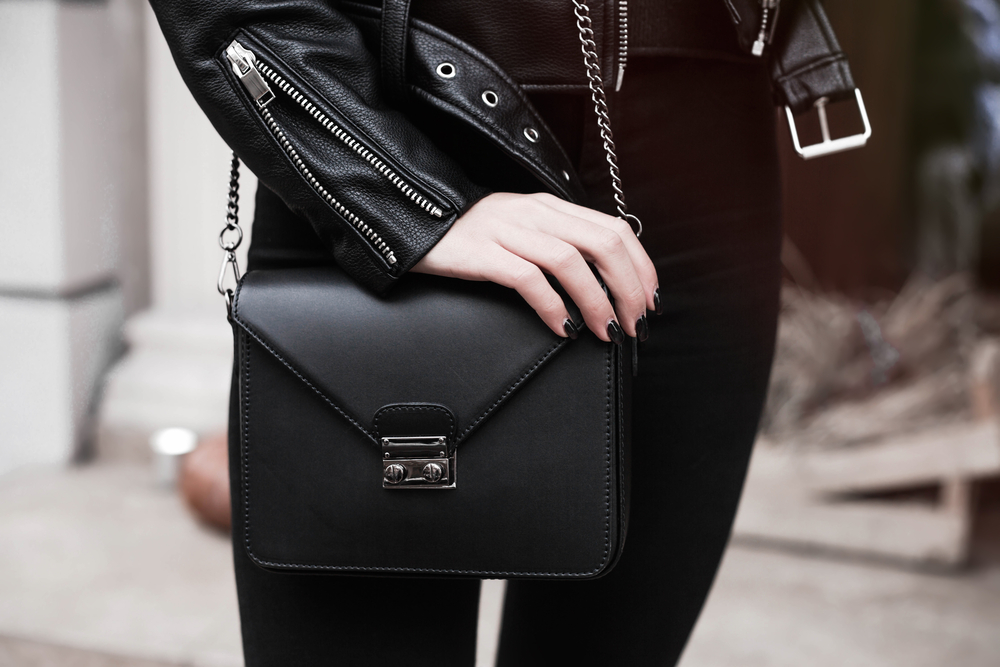 Detail,Of,A,Fashionable,Woman,Wearing,Short,Leather,Jacket,black,Purse,watches,black