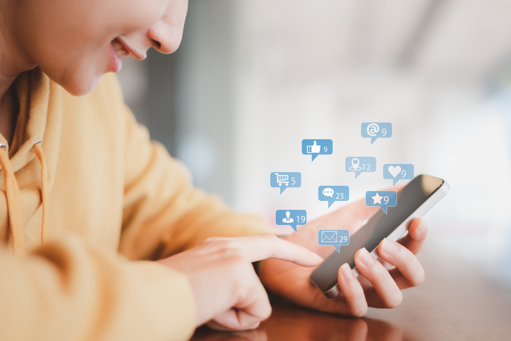 Social,Media,Interactions,On,Mobile,Phone,,Concept,With,Notification,Icons