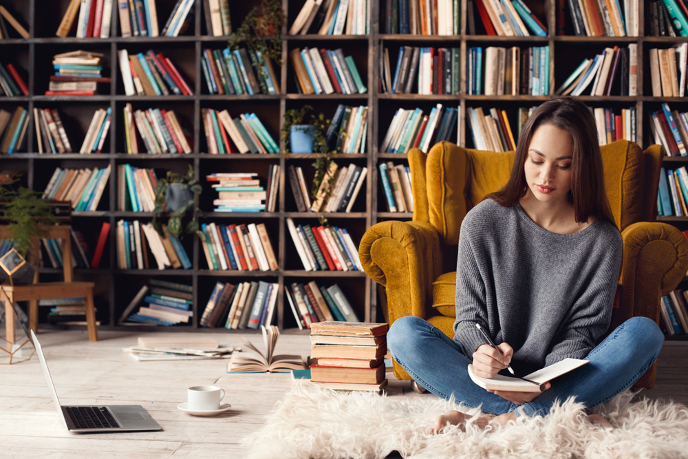 Young,Woman,Writer,In,Library,At,Home,Creative,Occupation,Sitting