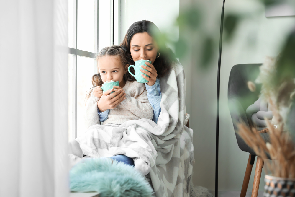 Woman,And,Her,Little,Daughter,With,Tasty,Cocoa,Drink,Near
