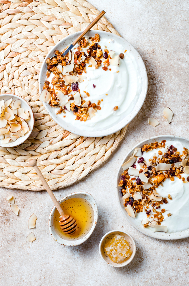 Breakfast,Bowls,With,Granola,,Yogurt,,Coconut,Chips,And,Honey.,Healthy