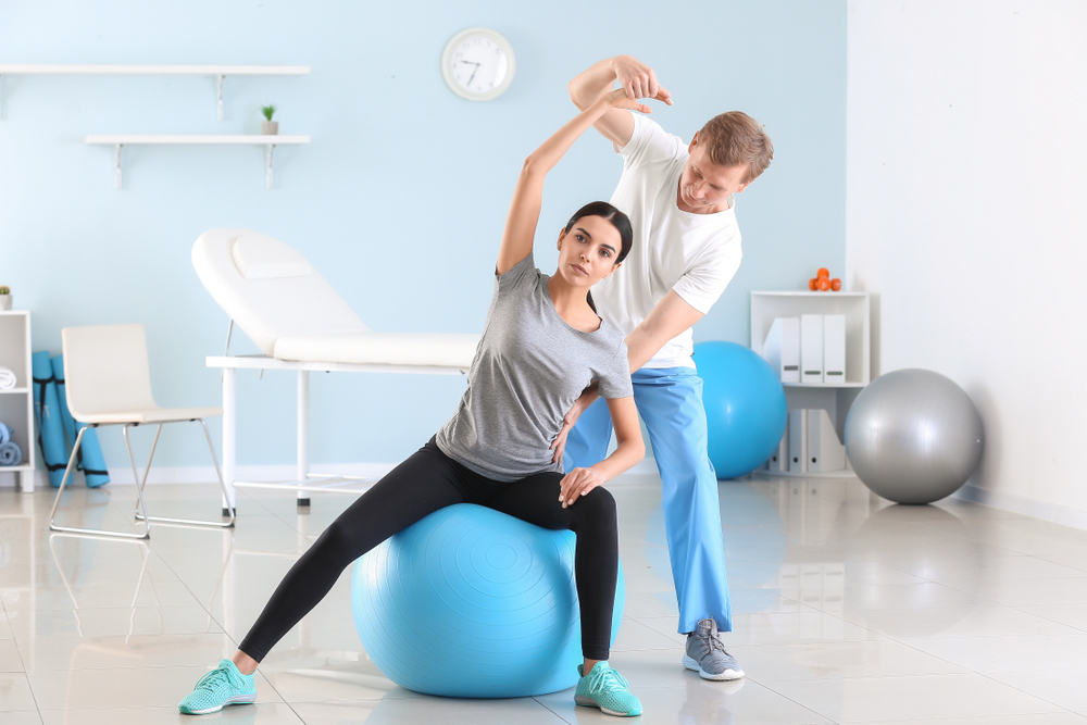 Physiotherapist,Working,With,Female,Patient,In,Rehabilitation,Center