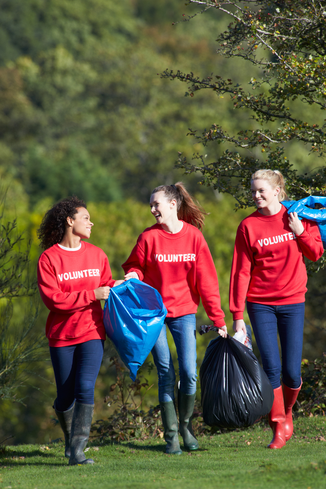 Group,Of,Female,Volunteers,Collecting,Litter