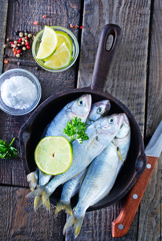 Raw,Fish,With,Lemon,On,The,Pan,And,On,A
