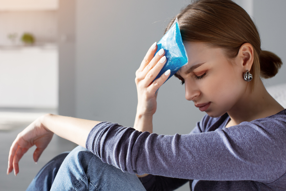Woman,Applying,Ice,Pack,As,Cold,Compress,On,Forehead,Due