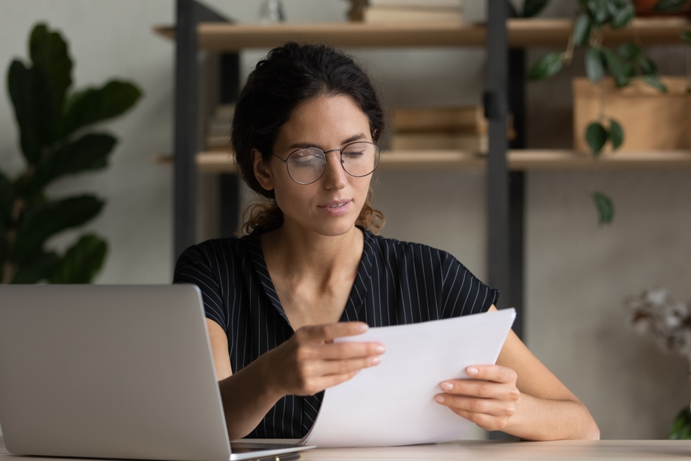 Important,Papers.,Serious,Hispanic,Female,Manager,In,Glasses,Engaged,In
