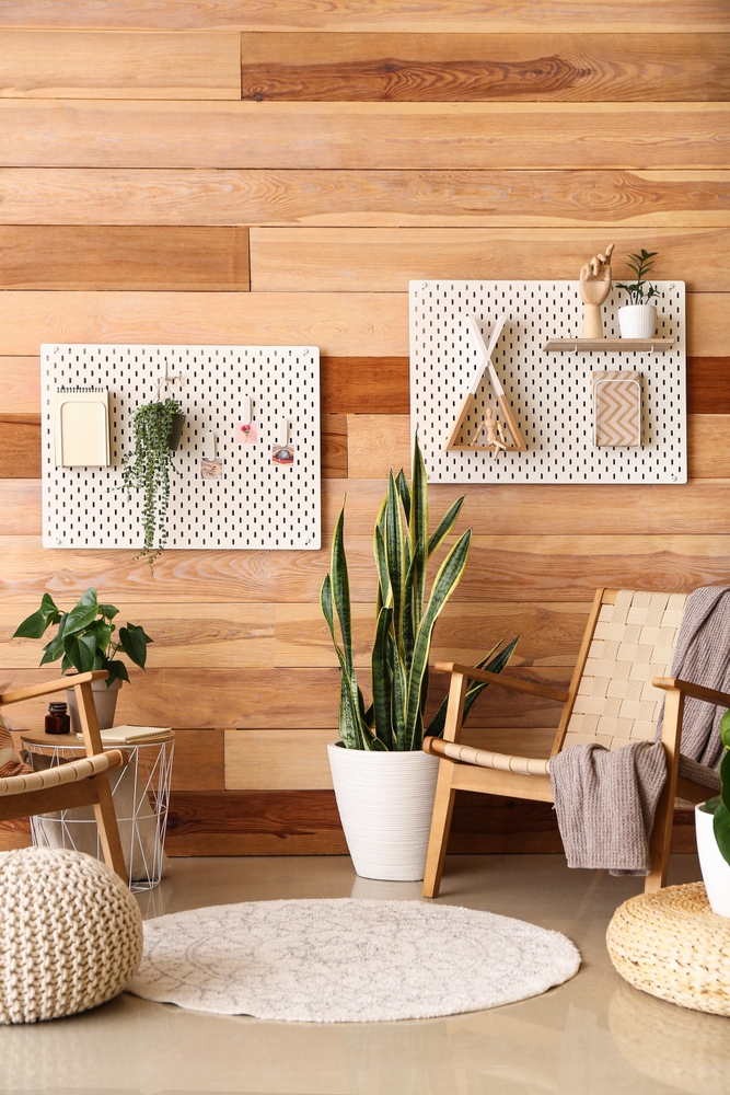 Armchairs,,Houseplants,And,Pegboards,On,Wooden,Wall,In,Living,Room