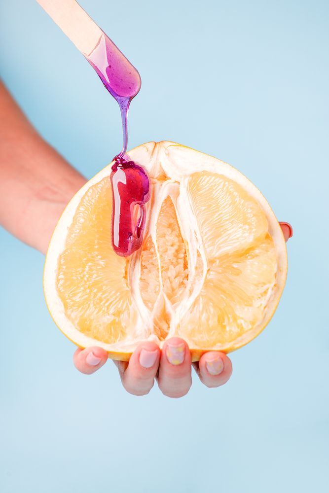 Half,Pomelo,Citrus,And,Liquid,Wax.,The,Concept,Of,Intimate