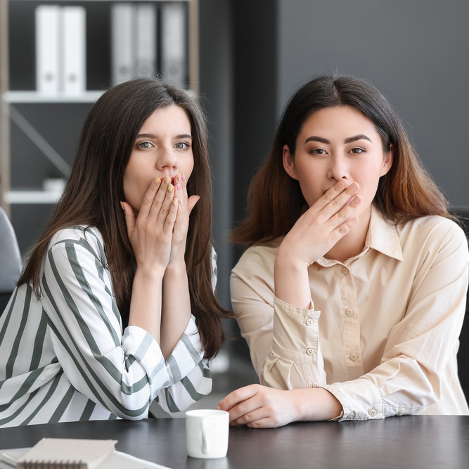 Female,Colleagues,Gossiping,In,Office