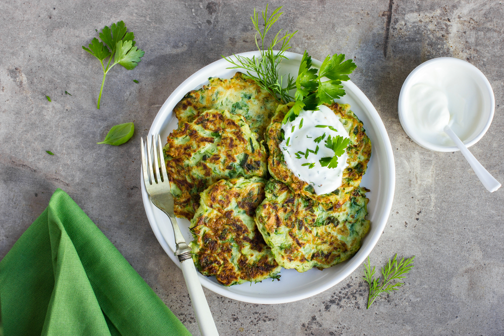 Zucchini,Fritters,,Vegetarian,Zucchini,Pancakes,,Served,With,Fresh,Herbs,And