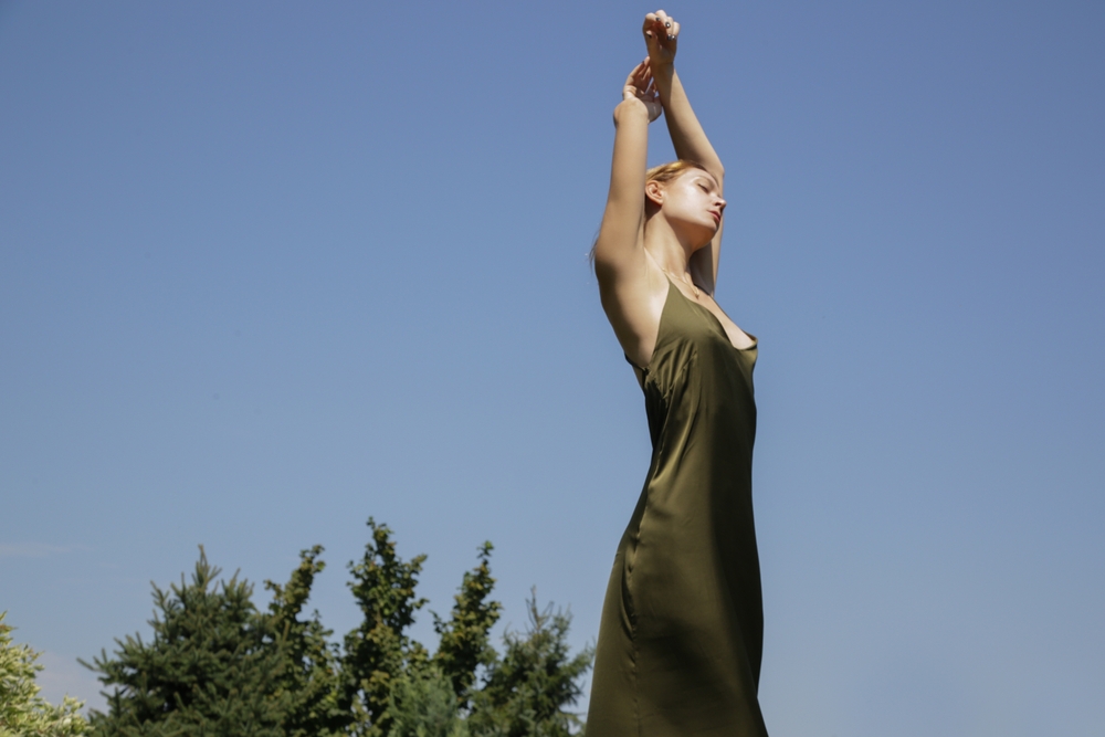 Outdoor,Image,Of,Young,Woman,In,Long,Green,Silk,Dress