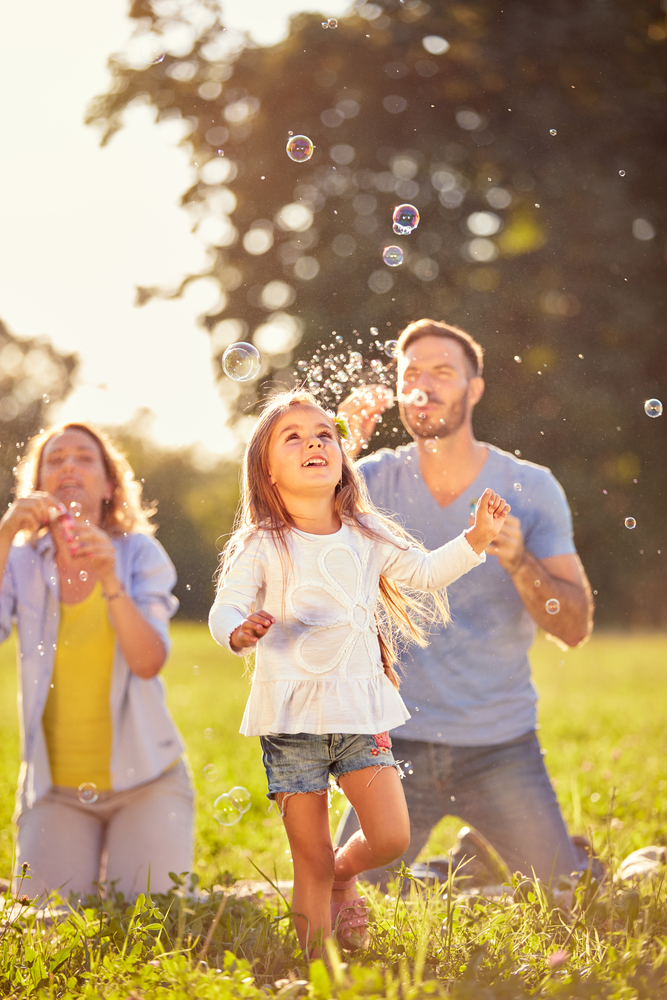 Fun,For,Female,Child,With,Colorful,Soap,Bubbles,Outdoor