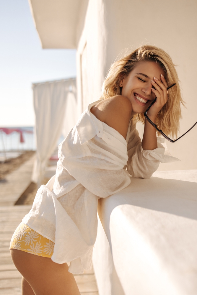 Happy,Radiant,Girl,With,Snow-white,Smile,Laughs,,Closing,Her,Eyes
