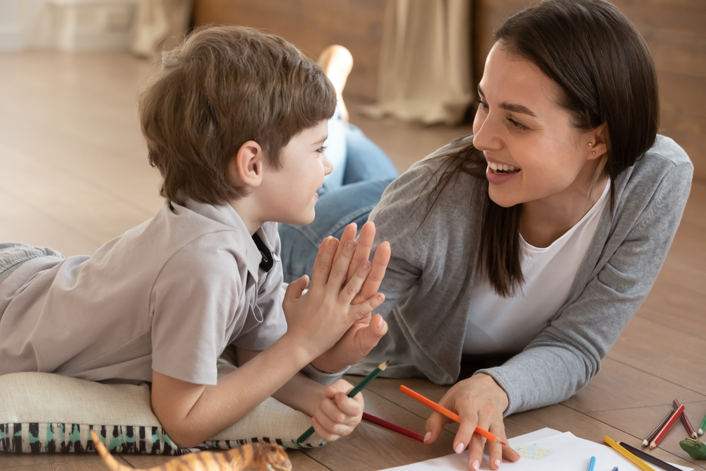Overjoyed,Young,Mother,And,Small,Preschooler,Son,Give,High,Five