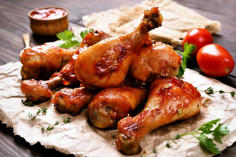 Baked,Chicken,Drumstick,On,Paper,,Close,Up,View