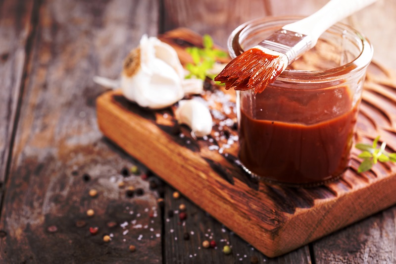 Barbeque,Sauce,With,A,Basting,Brush,In,A,Jar