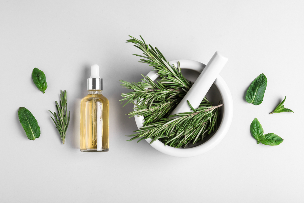 Flat,Lay,Composition,With,Herbal,Essential,Oil,On,Light,Background