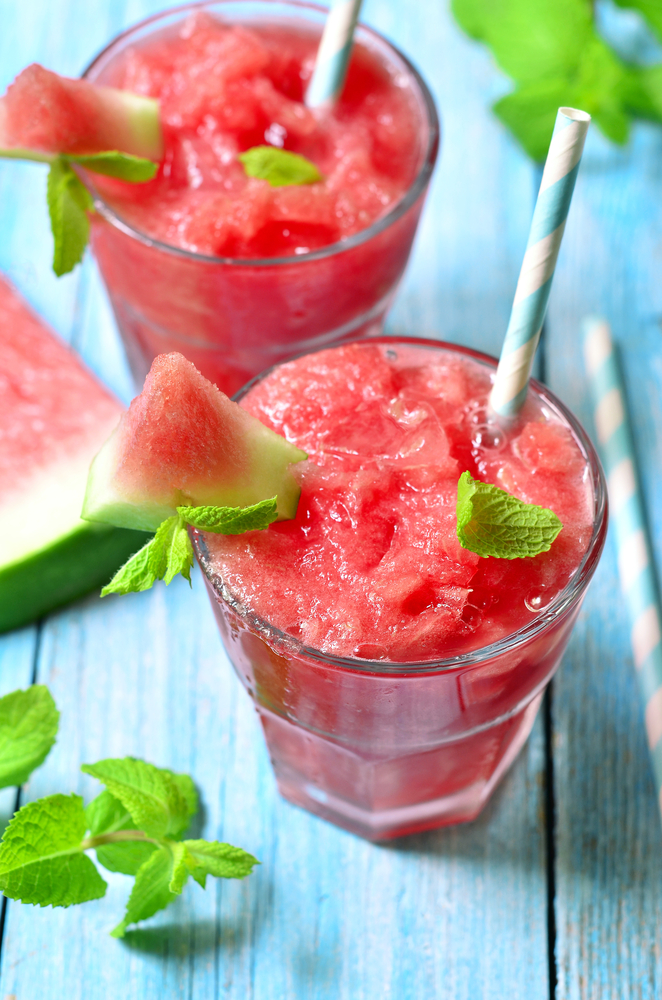 Watermelon,Smoothie,In,A,Glass,On,A,Blue,Wooden,Table.