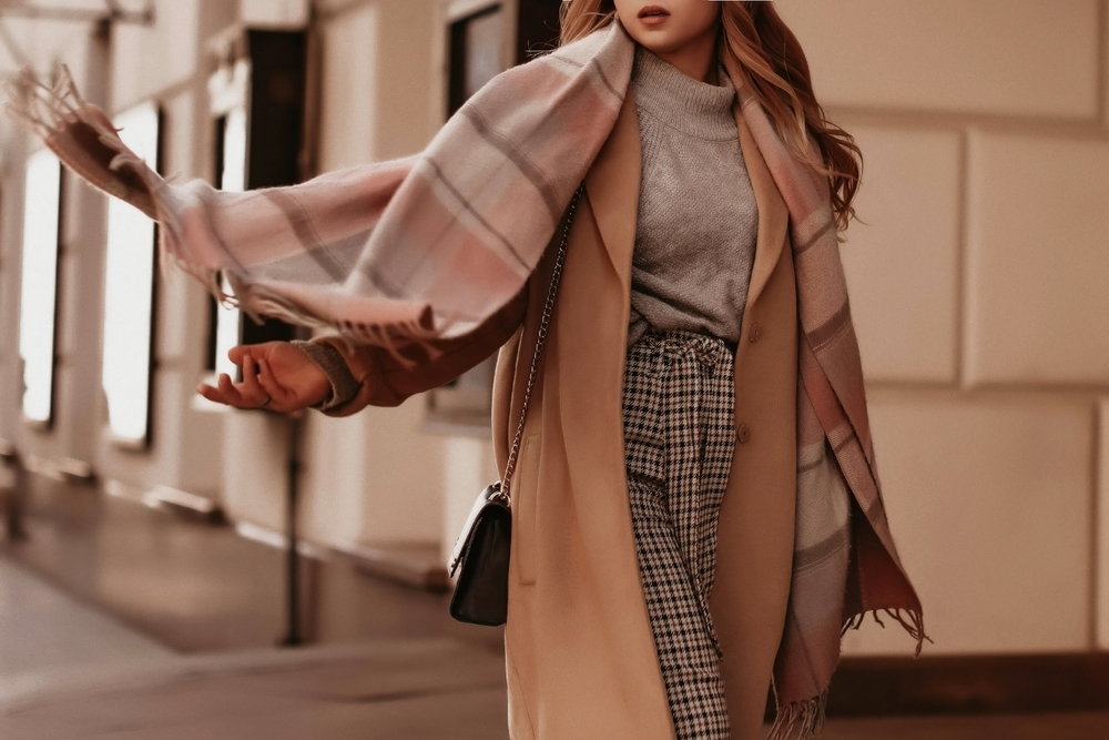 Young,Woman,With,Cropped,Head,In,The,Grey,Knitted,Cozy