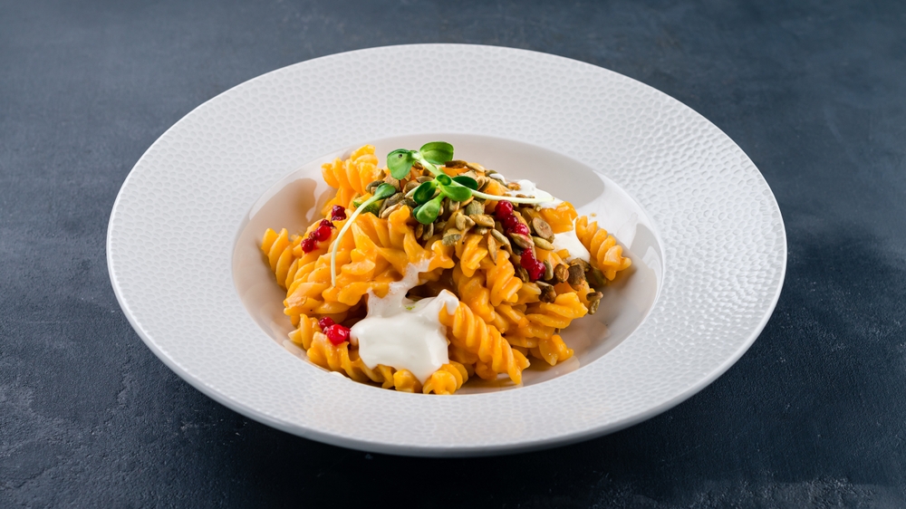 Traditional,Italian,Cuisine.,Italian,Pasta,With,Cranberries,,Sauce,,Microgreens,And