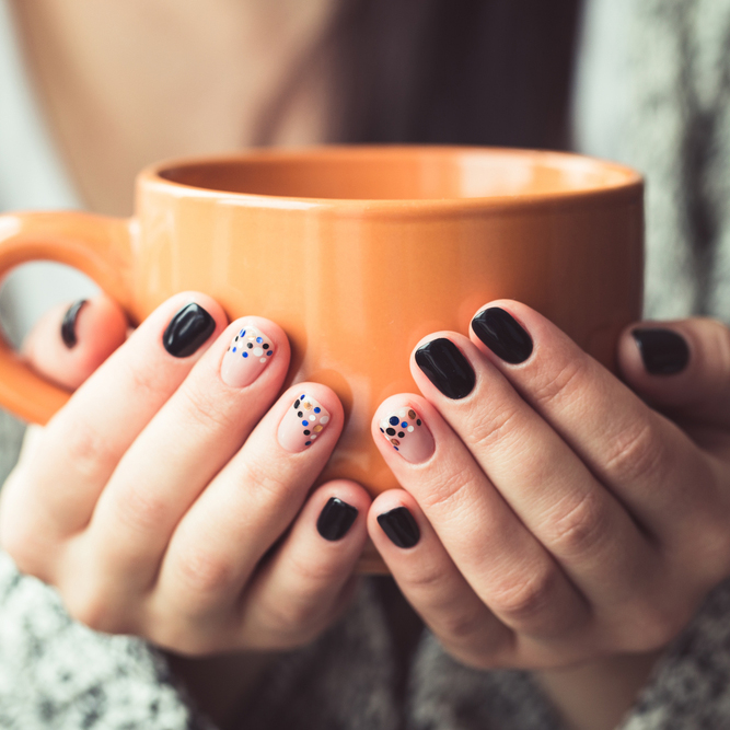 Woman,With,Beautiful,Manicure,Holding,A,Orange,Cup,Of,Cocoa