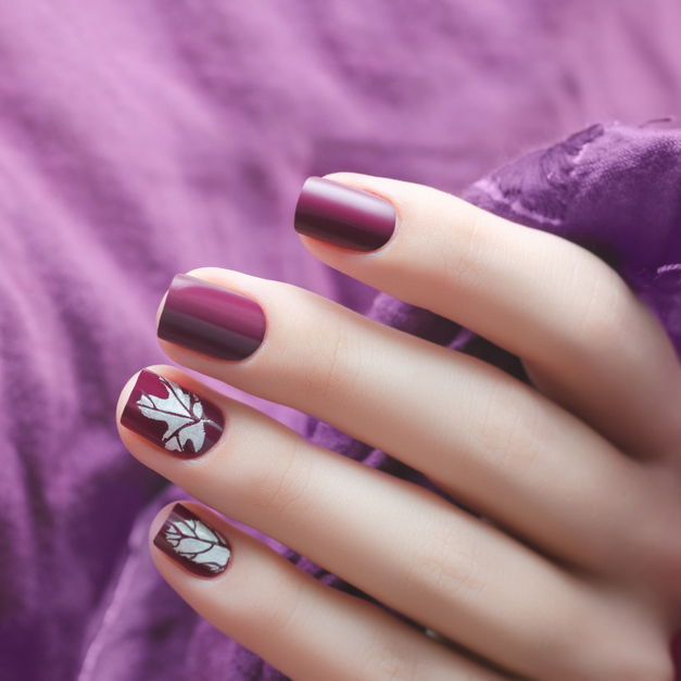 Female,Hand,With,Dark,Purple,Nail,Design