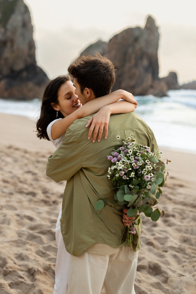 Young,Couple,In,Love,Embracing,Having,Romantic,Date,On,Beach,