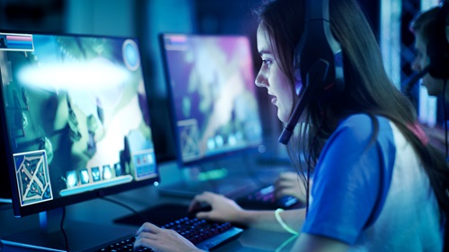 Professional Girl Gamer Plays in MMORPG/ Strategy Video Game on