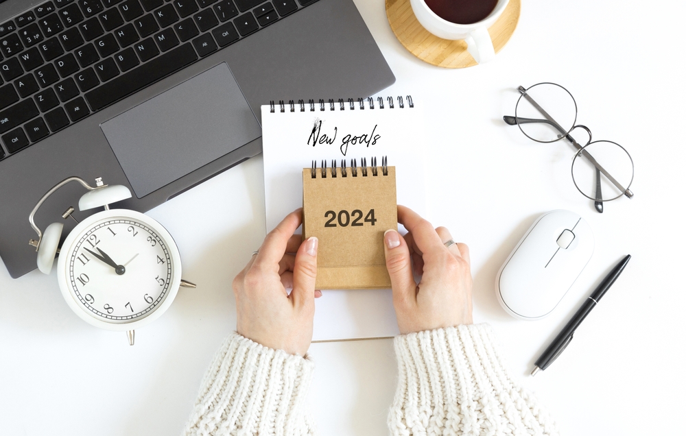 Woman's,Hand,Holds,Calendar,,Year,Change,From,2023,To,2024.